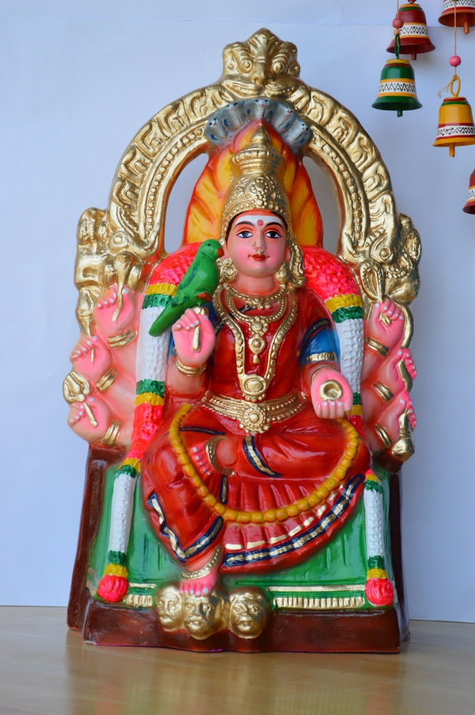 Handcrafted Navarathri Golu doll of Samayapuram Maariamman seated on a throne, holding a parrot, and adorned with detailed ornaments.