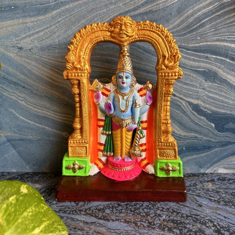 Handcrafted Navarathri Golu doll of Lord Perumal with Thaayyar in an ornate golden mandapam, adorned with vibrant colors and intricate detailing.