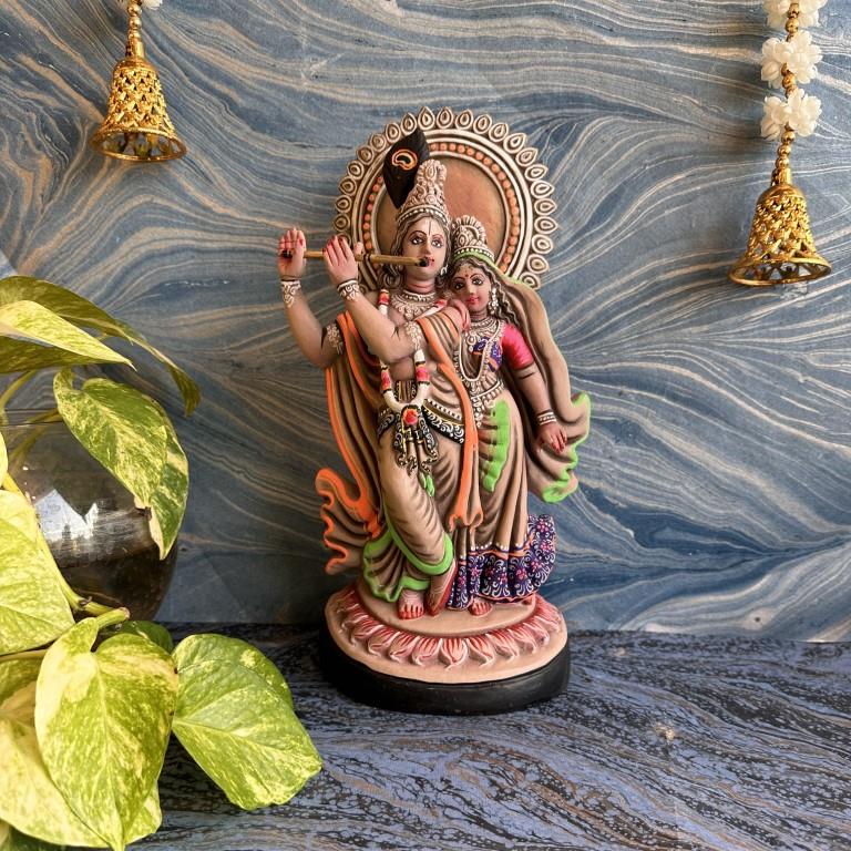 Handcrafted Radha Krishna Navarathri Golu dolls featuring Lord Krishna playing the flute and Radha standing beside him, adorned in traditional attire with vibrant colors.