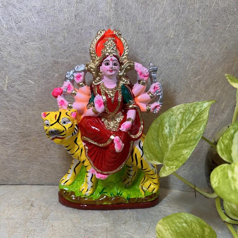 Handcrafted Navarathri Golu doll of Goddess Durga seated on a tiger, symbolizing power and devotion.
