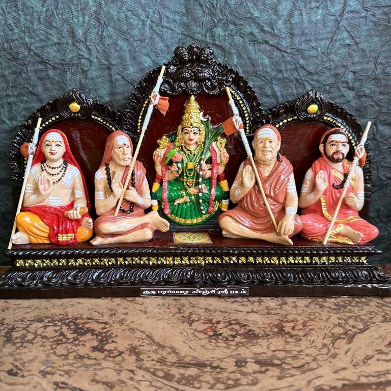 Navarathri Golu doll set featuring spiritual saints and a goddess idol, intricately designed and hand-painted in vibrant colors.
