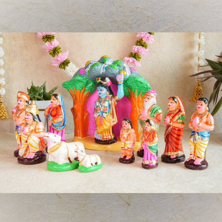 Handcrafted Krishna Govardhana Giri Navaratri Golu Doll Set featuring Lord Krishna lifting the Govardhana Giri, surrounded by devotees and cows in vibrant colors.