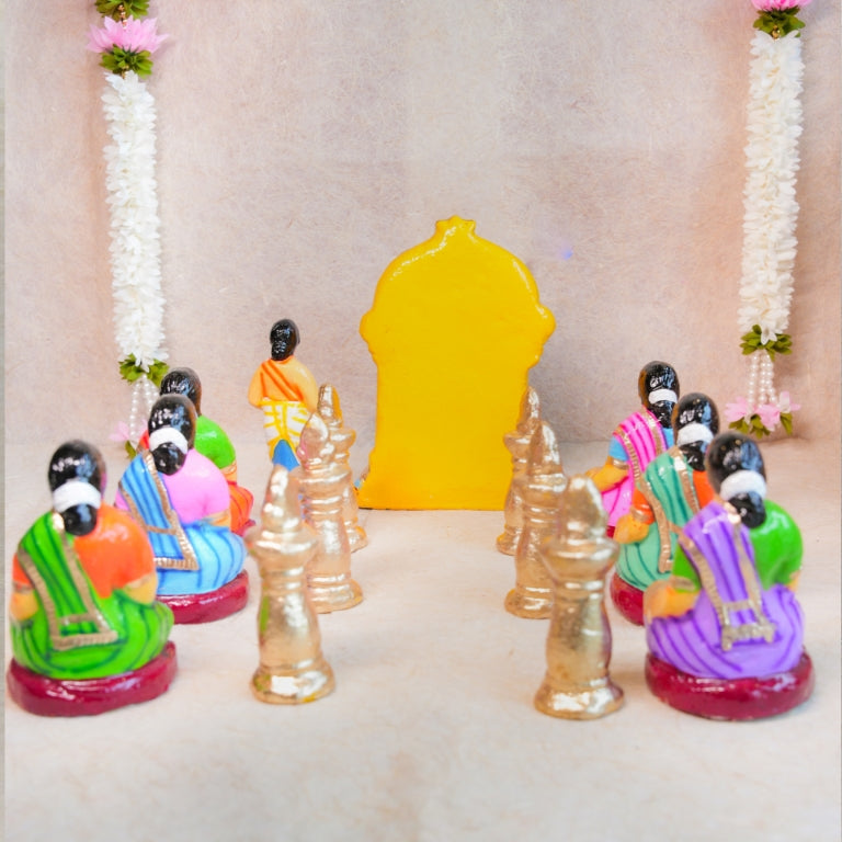 Handcrafted Navarathri Golu Dolls Kamakshi Vilakku Poojai set with Goddess Kamakshi, devotees, and silver lamps in vibrant colors.