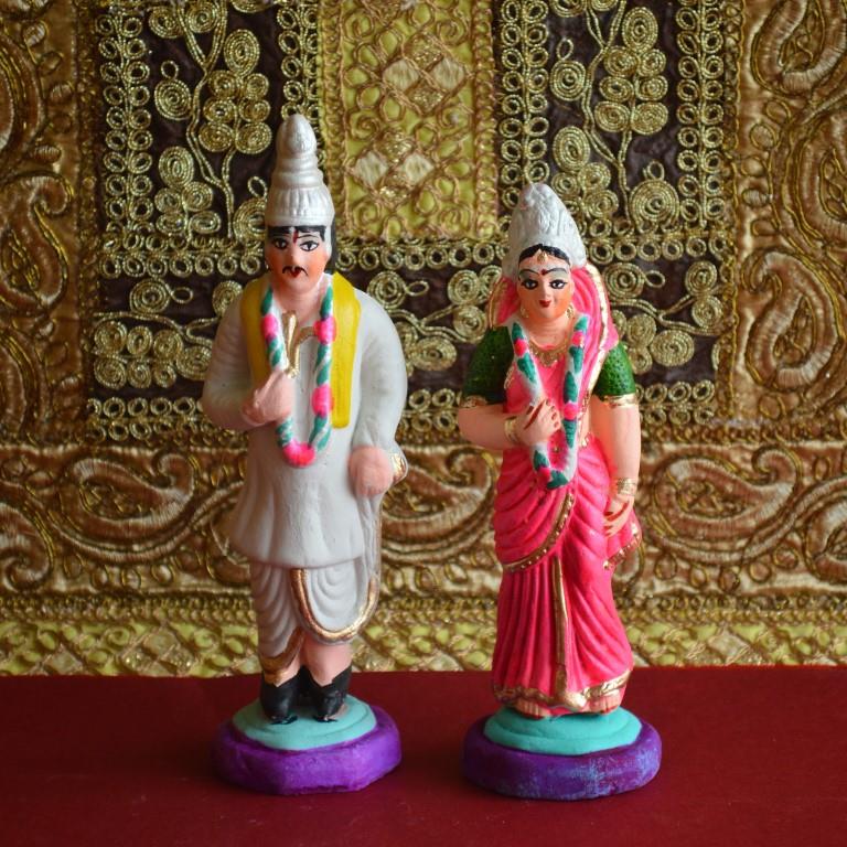 Handcrafted Navarathri Golu dolls depicting a traditional marriage couple in vibrant festive attire, ideal for festive displays.