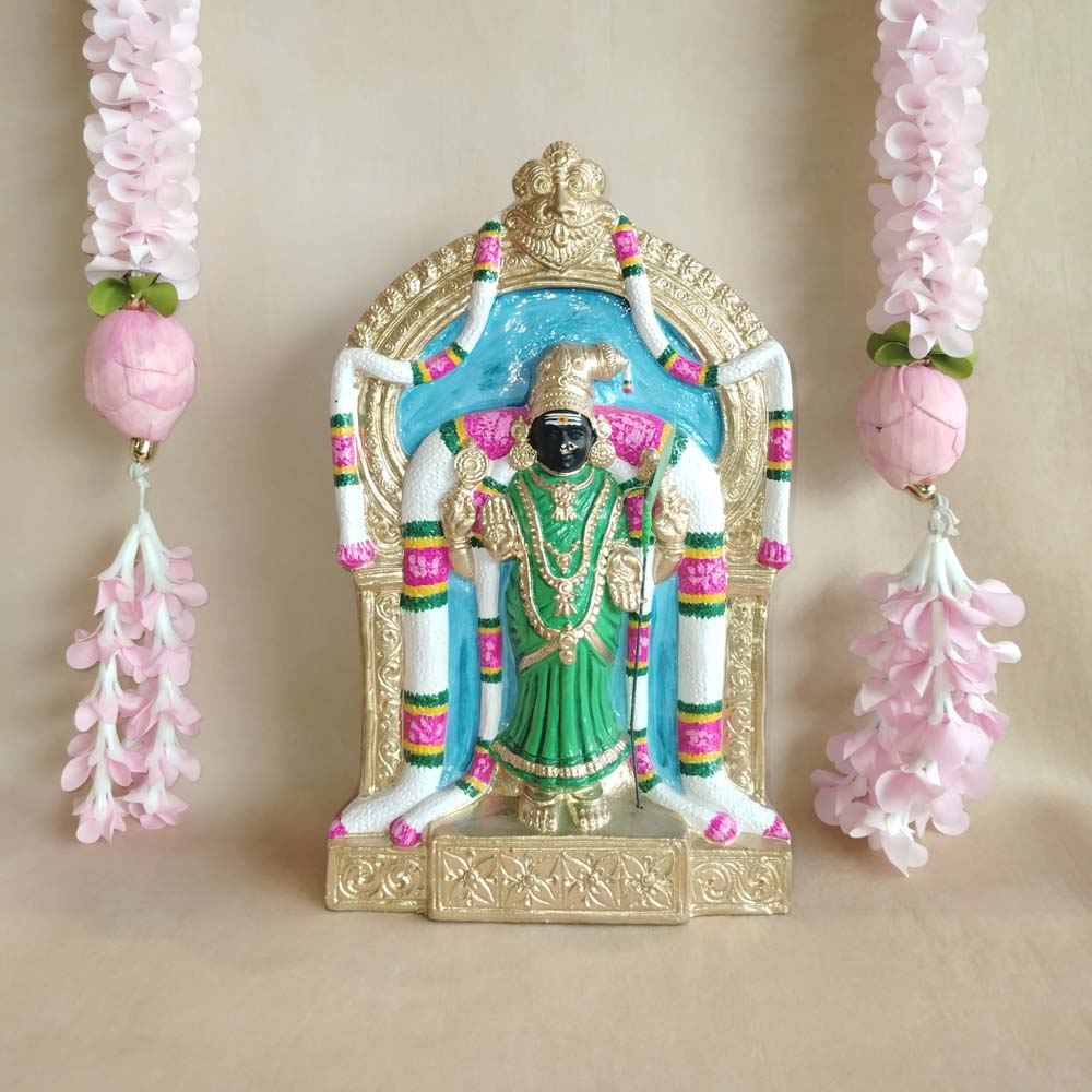 Handcrafted Abirami idol with intricate detailing, adorned with vibrant colors and floral garlands.
