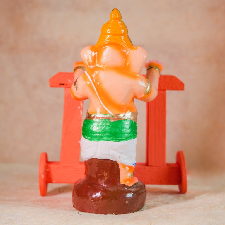 Handcrafted Nadaivandi Vinayagar idol featuring baby Ganesha on a wooden walker with vibrant colors for Navaratri Golu.