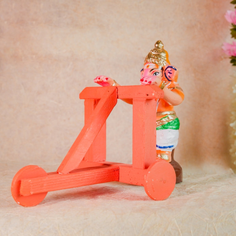 Handcrafted Nadaivandi Vinayagar idol featuring baby Ganesha on a wooden walker with vibrant colors for Navaratri Golu.