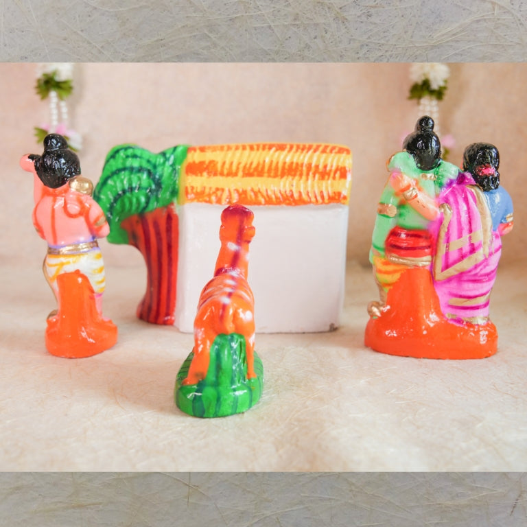 Handcrafted Navarathri Golu doll set featuring Lord Rama, Sita, Lakshmana, and the golden deer, with a hut and forest backdrop.