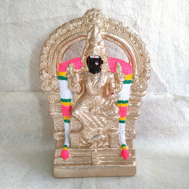 Handcrafted Navarathri Golu doll of Madurai Kaliamman with intricate gold detailing and vibrant decorations.
