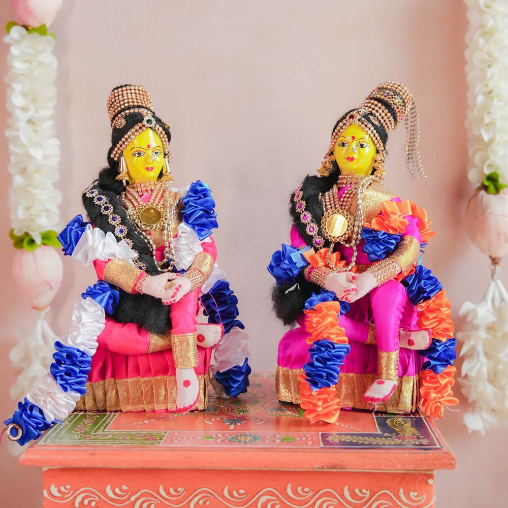 Navaratri Seated Devi Dolls – Handcrafted Golu Set with Vibrant Sarees, Jewelry, and Garlands for Festival Decor.