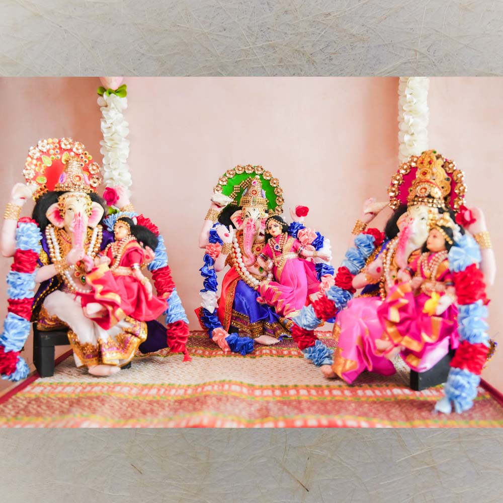 Navaratri Ganesh with Devi Doll Set – Handcrafted Traditional Decor with Garlands and Vibrant Attire for Golu Display.