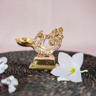 Gold Finish Peacock Lamp with Intricate Design and Ornate Detailing.