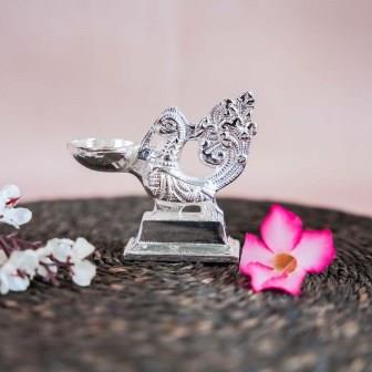Silver Finish Peacock Lamp with Intricate Detailing and Elegant Design.