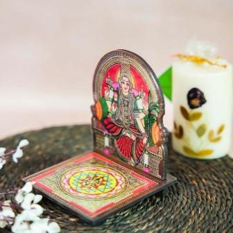 Mariamman Diya Wall Stand with vibrant hand-painted art of Goddess Mariamman and a detailed Sri Yantra design base.