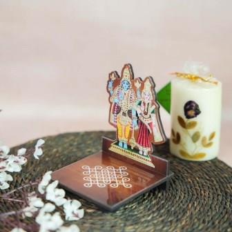 Shivan Parvati Diya Wall Stand featuring vibrant hand-painted artwork of Lord Shiva and Goddess Parvati with a kolam design base.