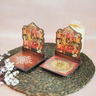 Ramar Diya Wall Stand with a kolam and Sri Yantra base, showcasing a vibrant depiction of Lord Rama and family for puja and home decor.