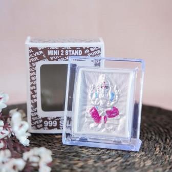 Silver Ganesh Frame in a Transparent Stand with Detailed Carving of Lord Ganesha.