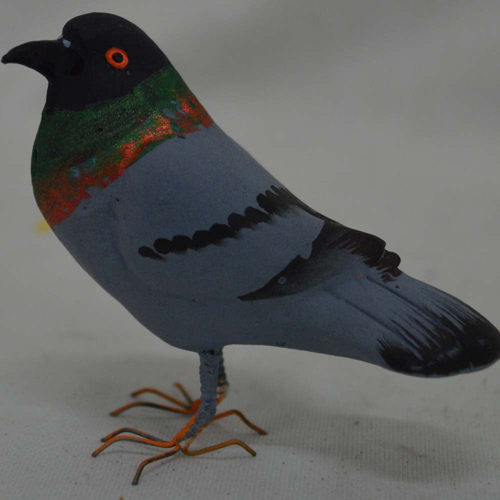 Handcrafted Navaratri Golu gray dove figurine with green and orange neck accents and intricate detailing.