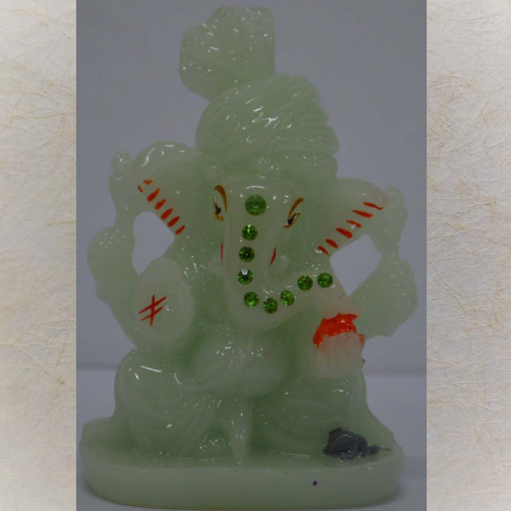Enchanting Radium Ganesh Idol with glow-in-the-dark features and embedded sparkling stones, perfect for decor and spiritual use.