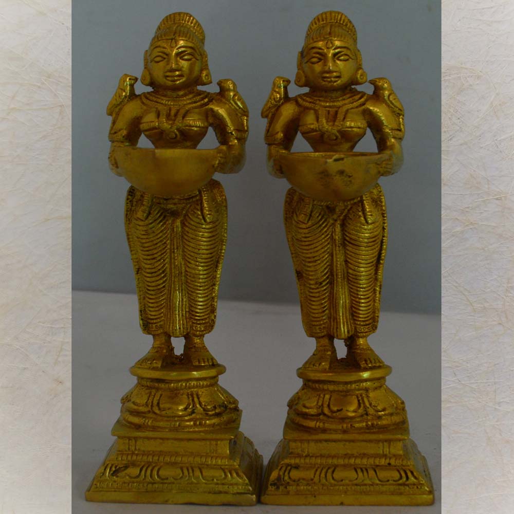 Traditional brass Eternal Paavai Villakku oil lamps with elegant maiden design, set of two.