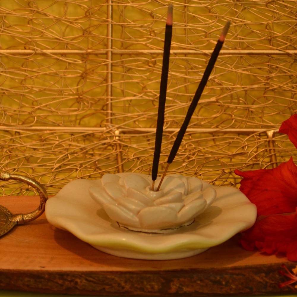 Cera Round Plate Agarvathi Holder with lotus design for incense sticks.
