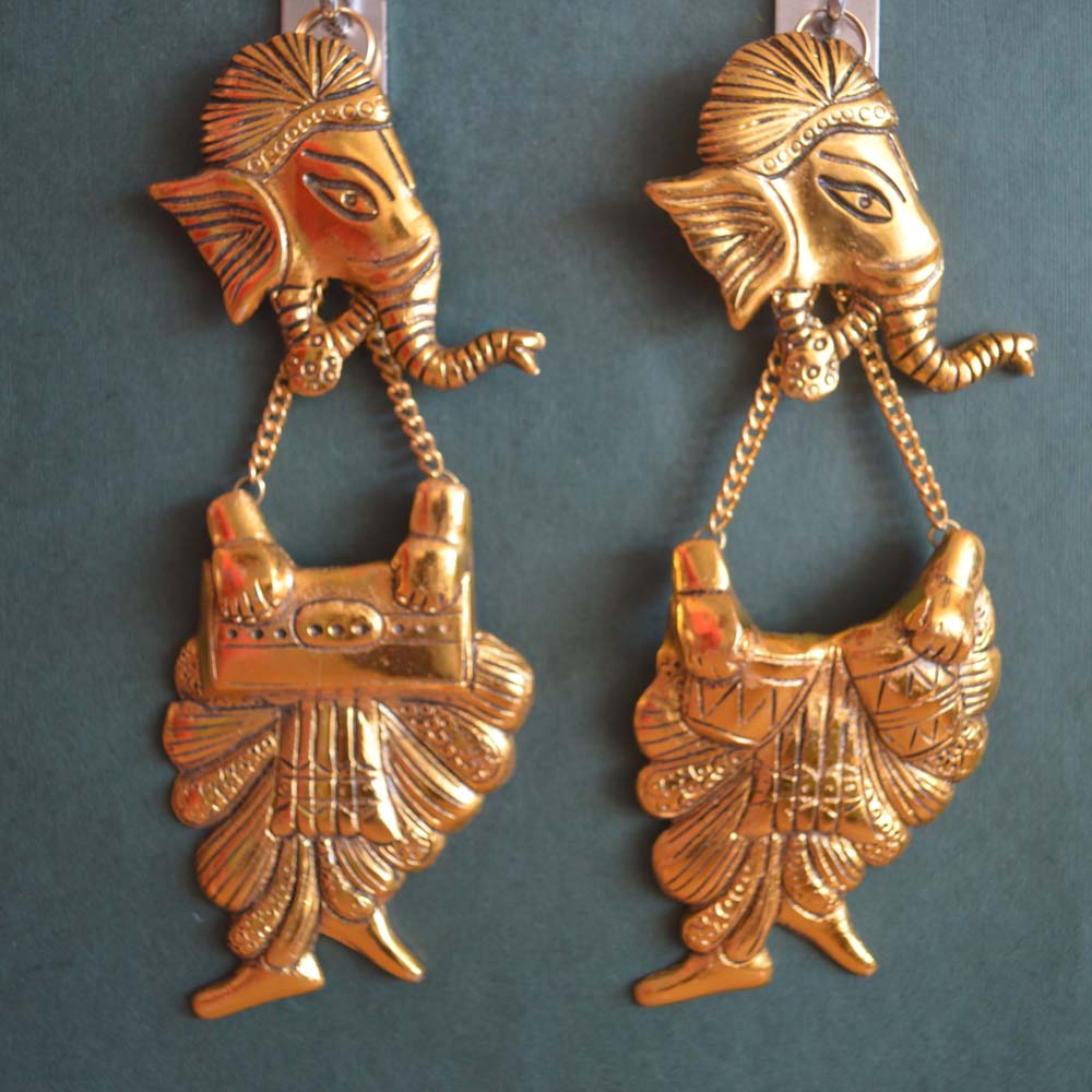 Oxidized gold wall hanging pair featuring Lord Ganesha playing musical instruments, intricately crafted with traditional details.