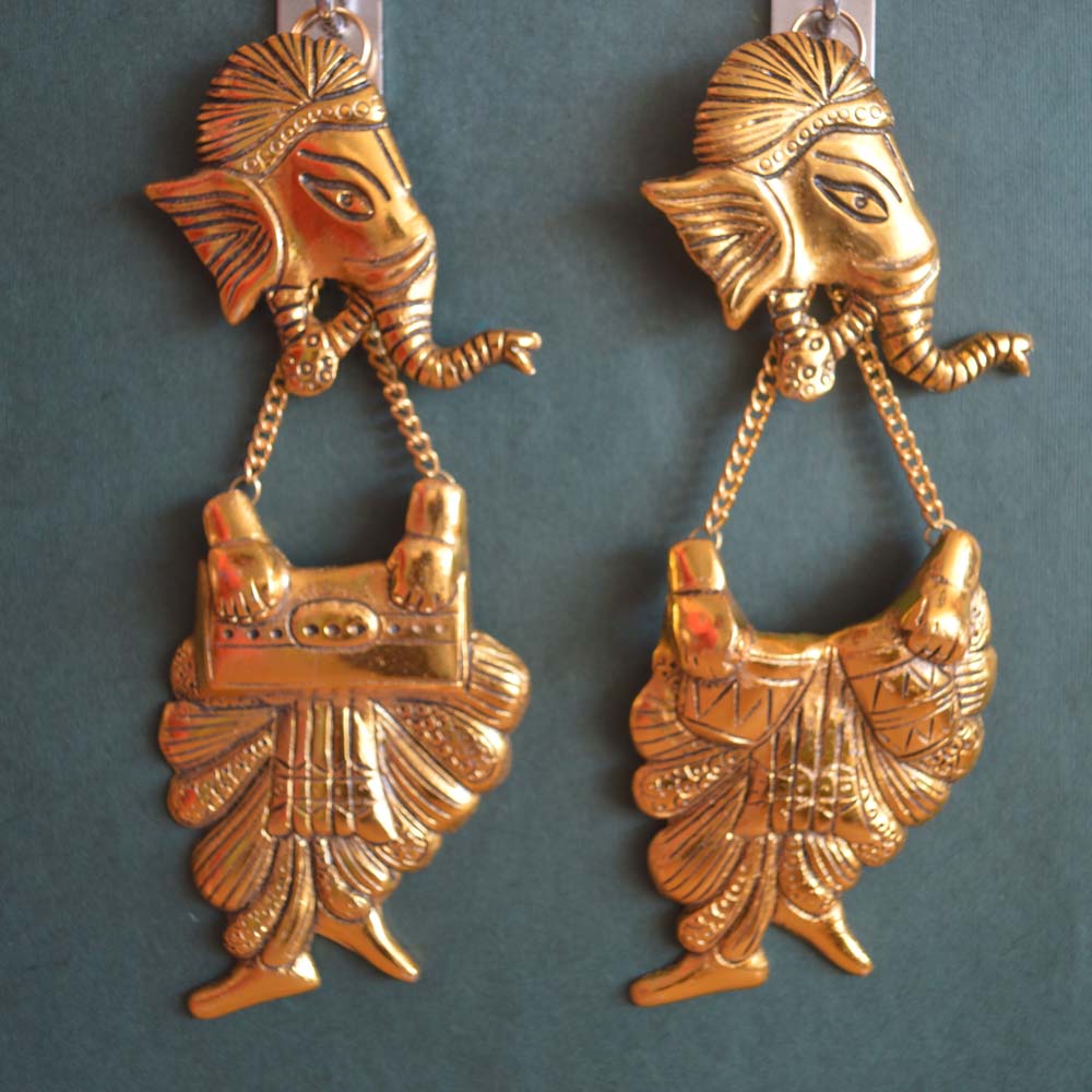 Oxidized gold wall hanging pair featuring Lord Ganesha playing musical instruments, intricately crafted with traditional details.