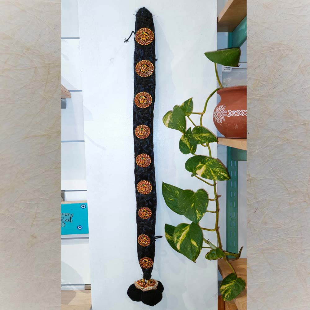 Traditional Circular Jada Billa hair ornament with black braid, gold circular embellishments, and red-green stone accents