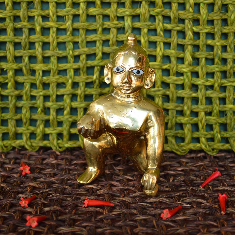 Eternal Baby Krishna Idol, 7-inch handcrafted brass figurine in a crawling pose with intricate detailing.