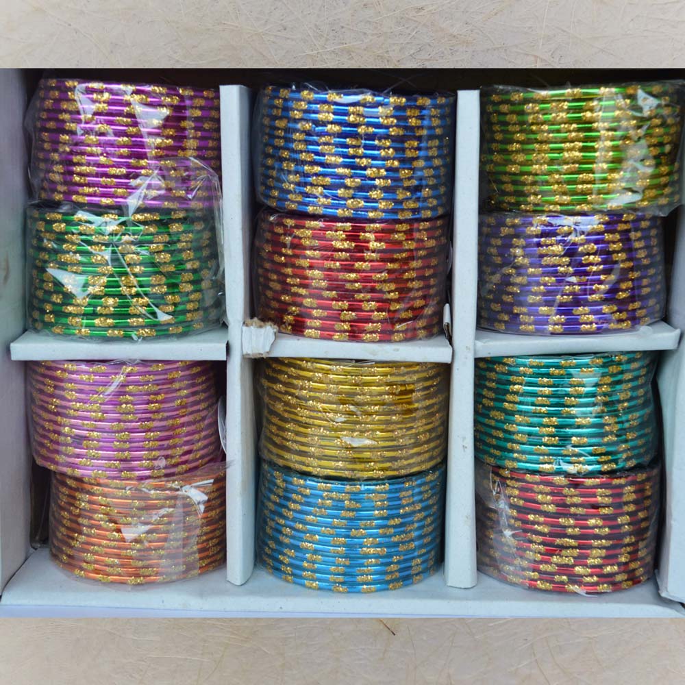 Box of 12 colorful glass bangles with golden dash patterns, ideal for festive and everyday use.