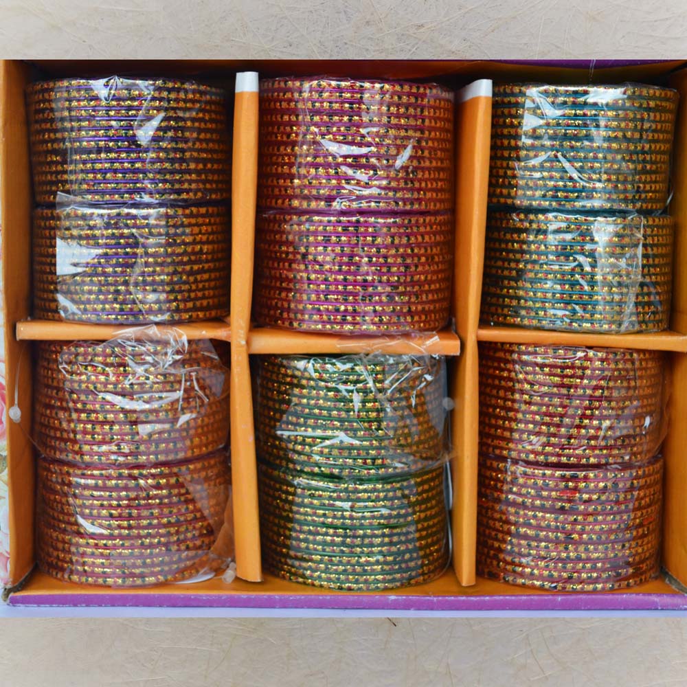 Box of 12 colorful glass bangles with golden dotted design, ideal for traditional wear, weddings, and festive occasions.