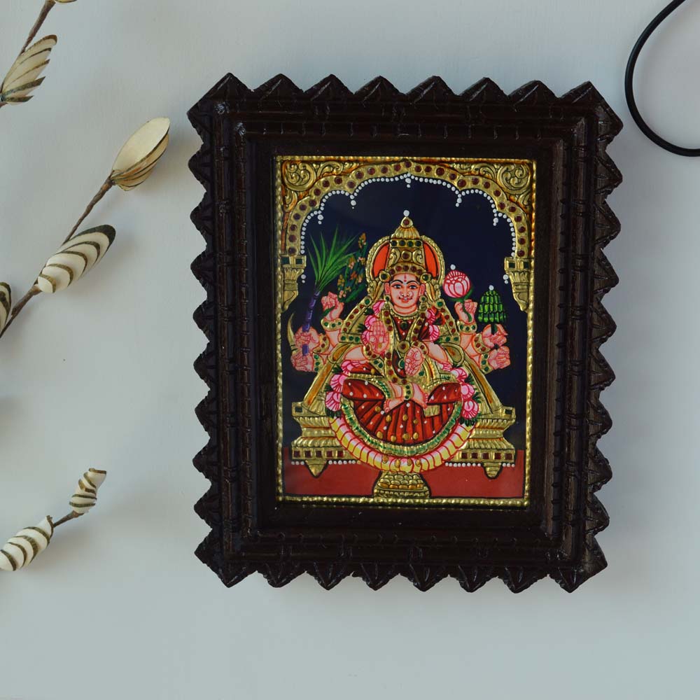 Tanjore Painting of Goddess Dhaaniya Lakshmi with Gold Foil and Lotus Motifs in a Carved Wooden Frame