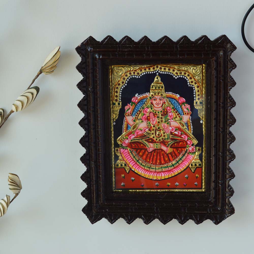 Tanjore Painting of Goddess Aishwarya Lakshmi with Gold Foil Embellishments in a Wooden Carved Frame