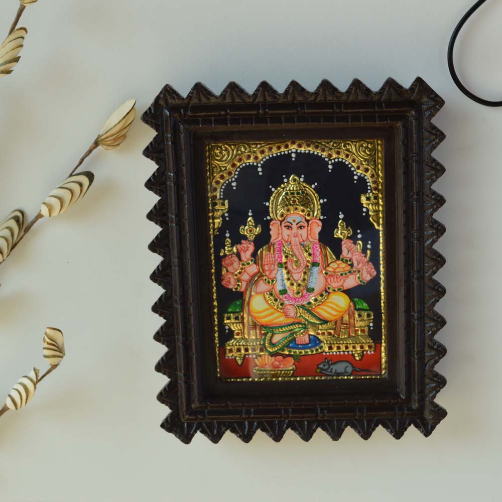 Bejeweled Tanjore Painting of Lord Ganesh in a Carved Wooden Frame with Gold Foil Detailing