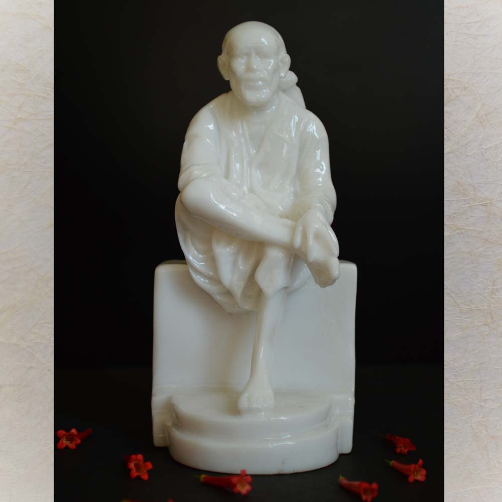 Handcrafted Chandan Sai Baba idol in marble finish sitting in a serene pose, symbolizing peace and devotion.