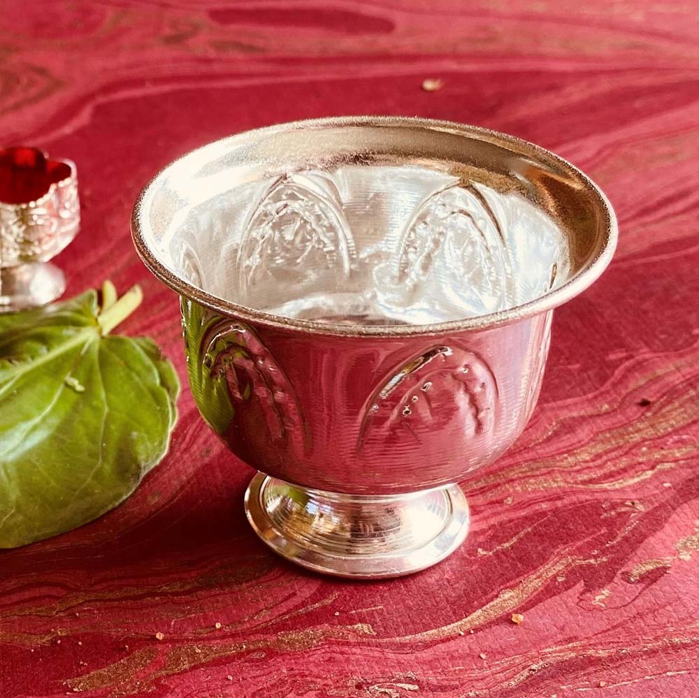 Silvery Chandan Cup Small with floral engravings, used for holding sandalwood paste in religious rituals.