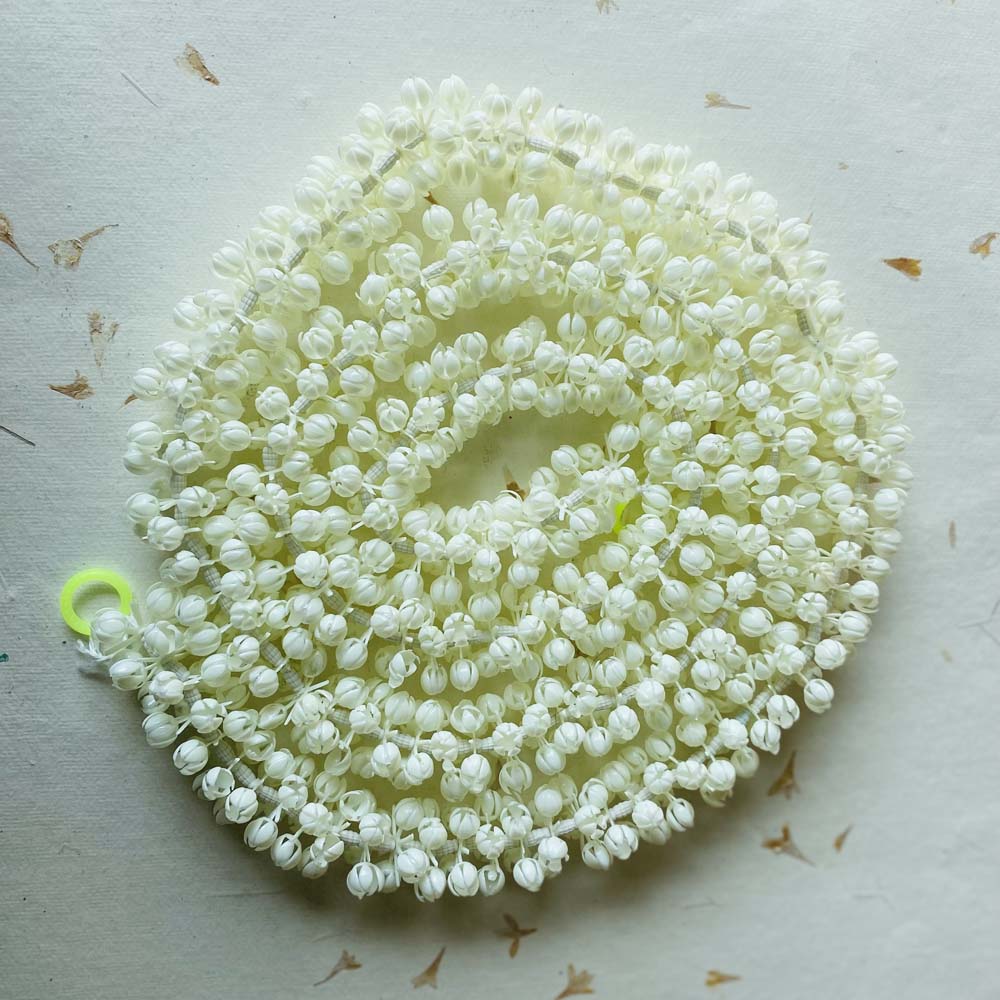 Plain jasmine-inspired white garland, ideal for puja, weddings, and traditional Indian decor.