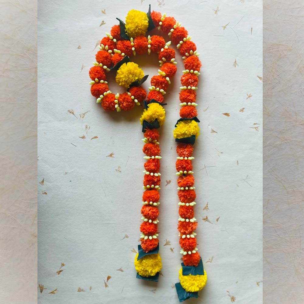 Big Laddu single-string garland in orange and yellow with white bud accents and green leaves, ideal for festive and traditional Indian decor.