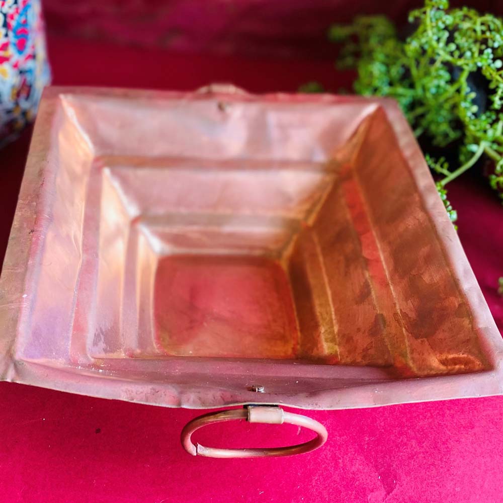 Eternal Hawan Kund in copper with a square design and a ring handle for religious fire rituals.