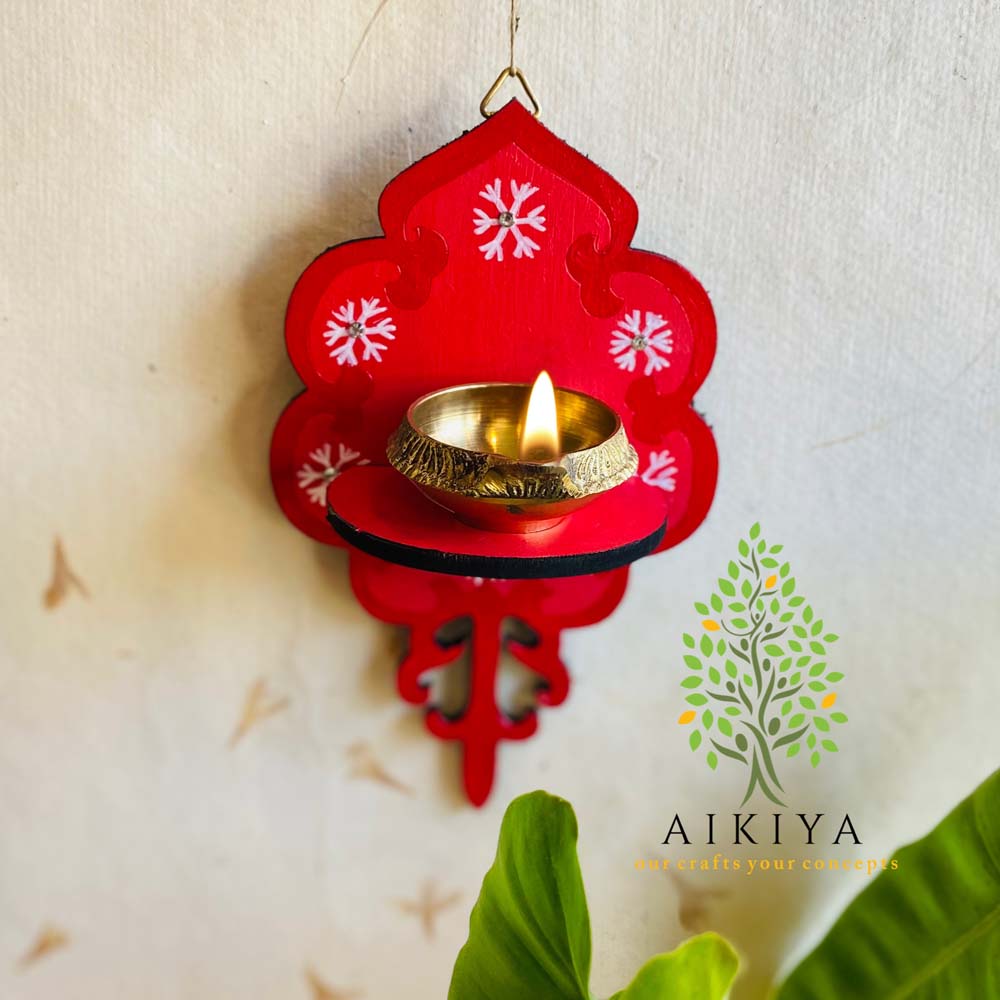 Red Wooden Wall Bracket with white floral motifs, perfect for holding oil lamps or decorative items.