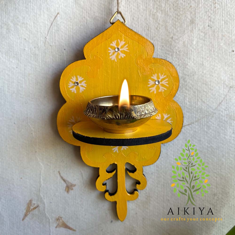 Yellow Wooden Wall Bracket with white floral motifs, perfect for holding oil lamps or decorative accents.