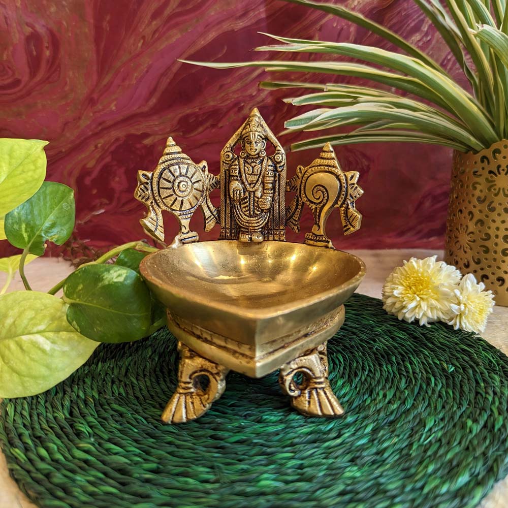 Brass Sanghu Chakra Balaji idol with intricate detailing, accompanied by a pooja bowl, perfect for spiritual and festive decor.