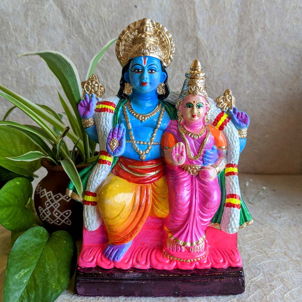 Navarathri Golu Dolls - Vibrant figurine of Lord Vishnu and Goddess Lakshmi seated together, hand-painted with intricate details.