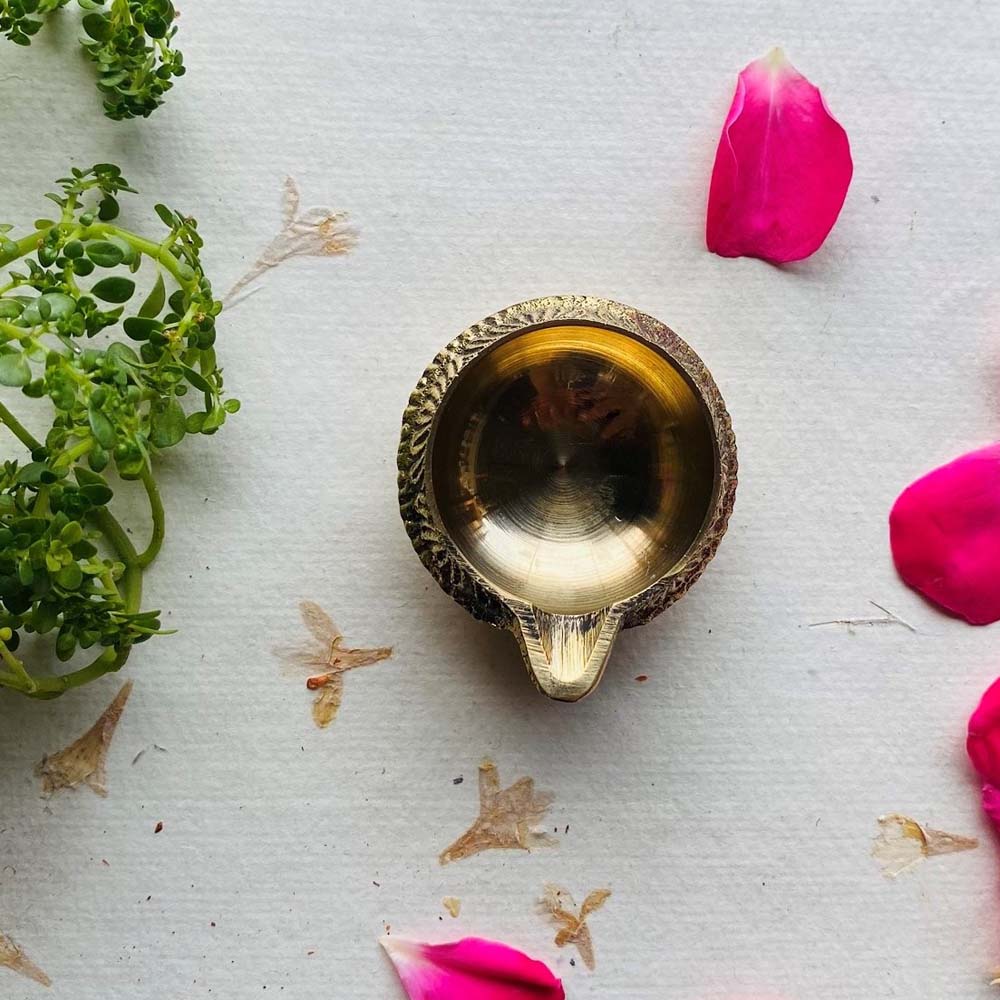 Set of 10 Kuber Brass Oil Lamps with intricate floral designs, perfect for festivals and pooja decorations.