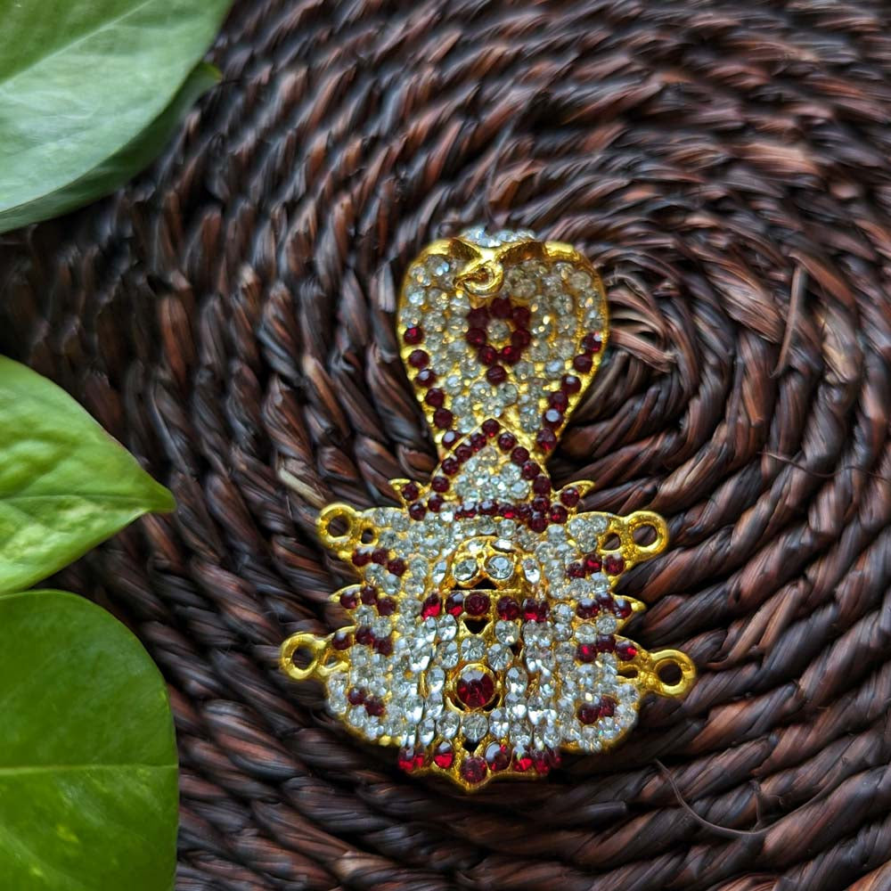 Traditional Kreedam with white and red rhinestones on a golden base, ideal for deity decoration or festive occasions.