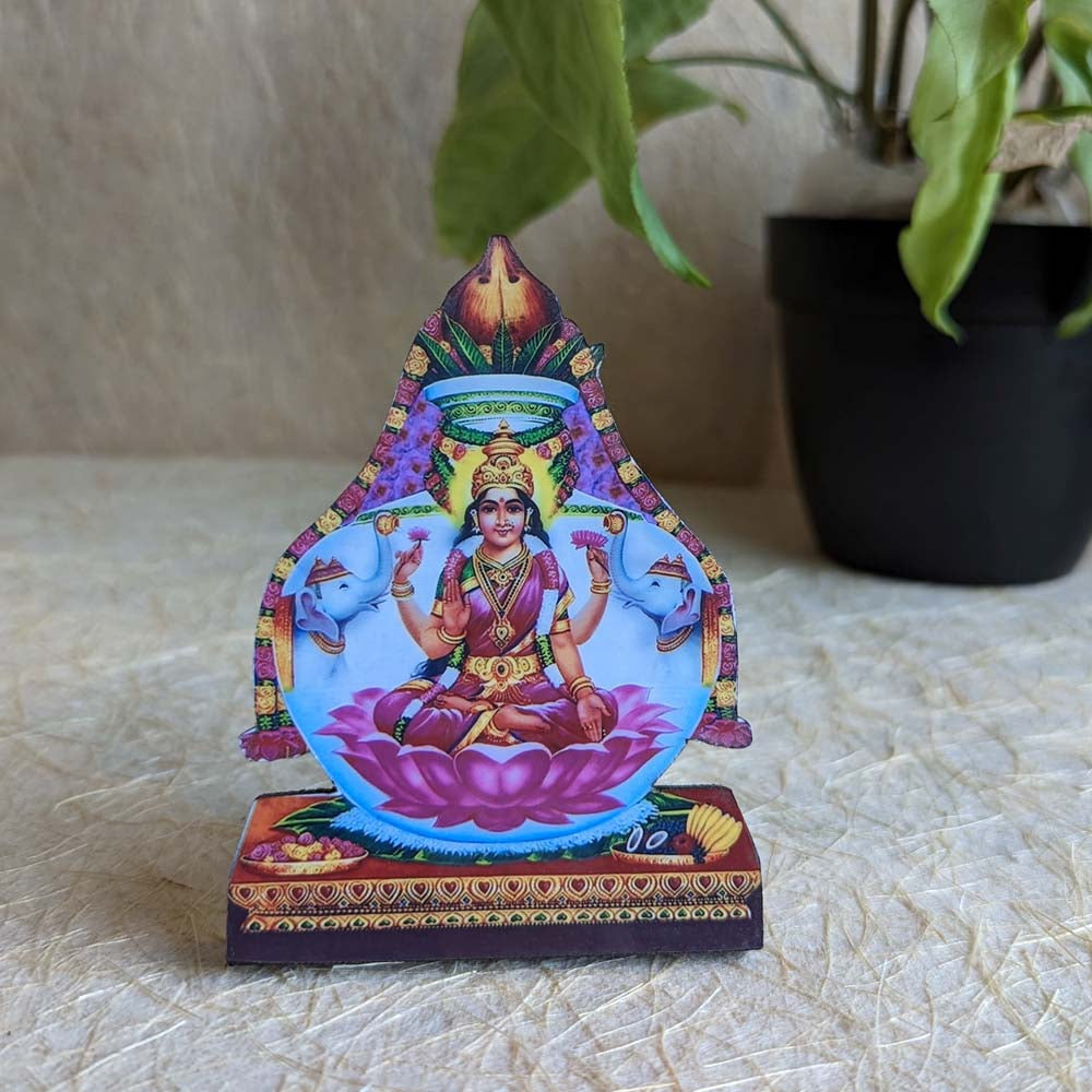 Gajalakshmi decorative tabletop stand featuring Goddess Lakshmi seated on a lotus with elephants, ideal for pooja rooms and spiritual spaces.