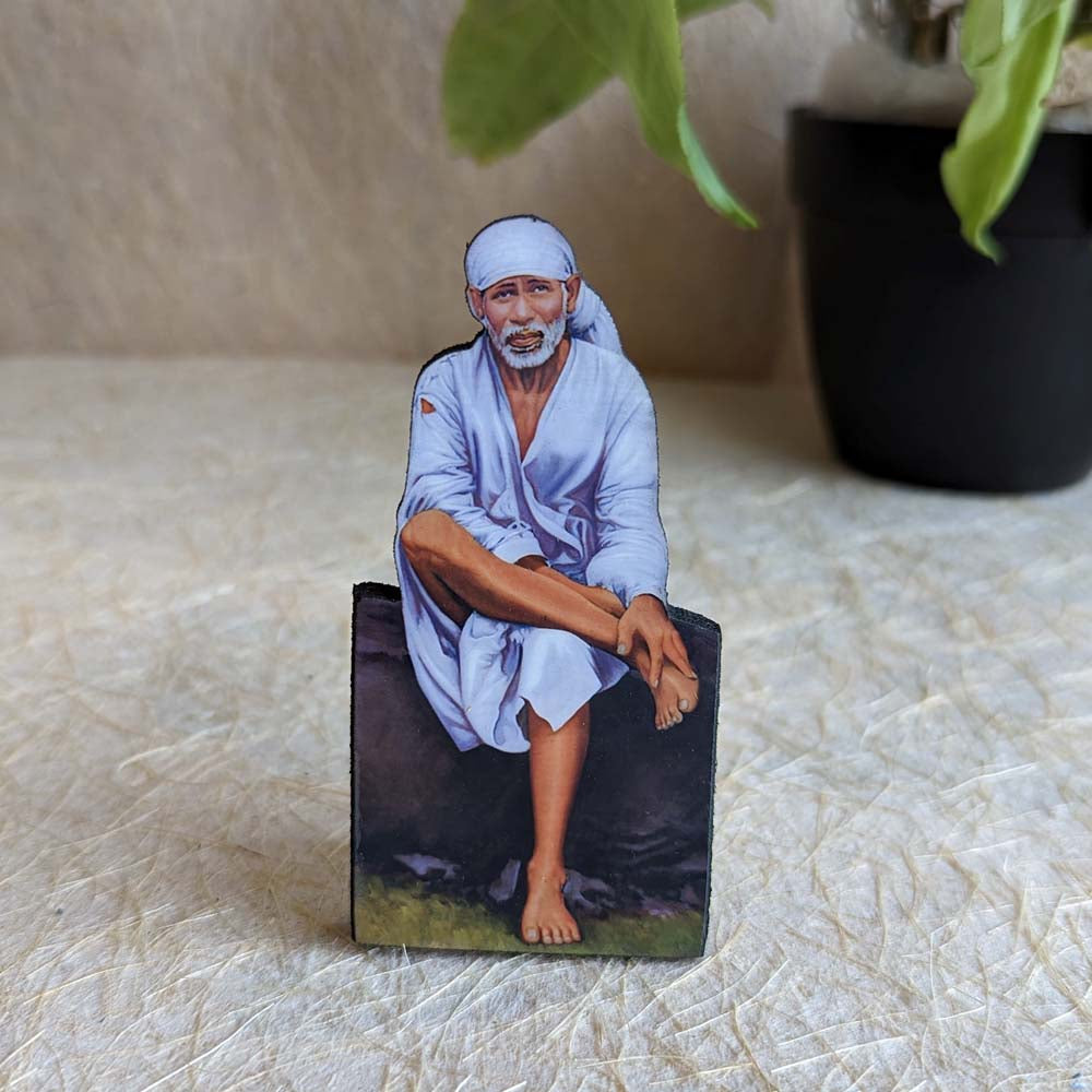 Decorative tabletop stand featuring Sai Baba in a meditative posture, perfect for pooja rooms and spiritual spaces.