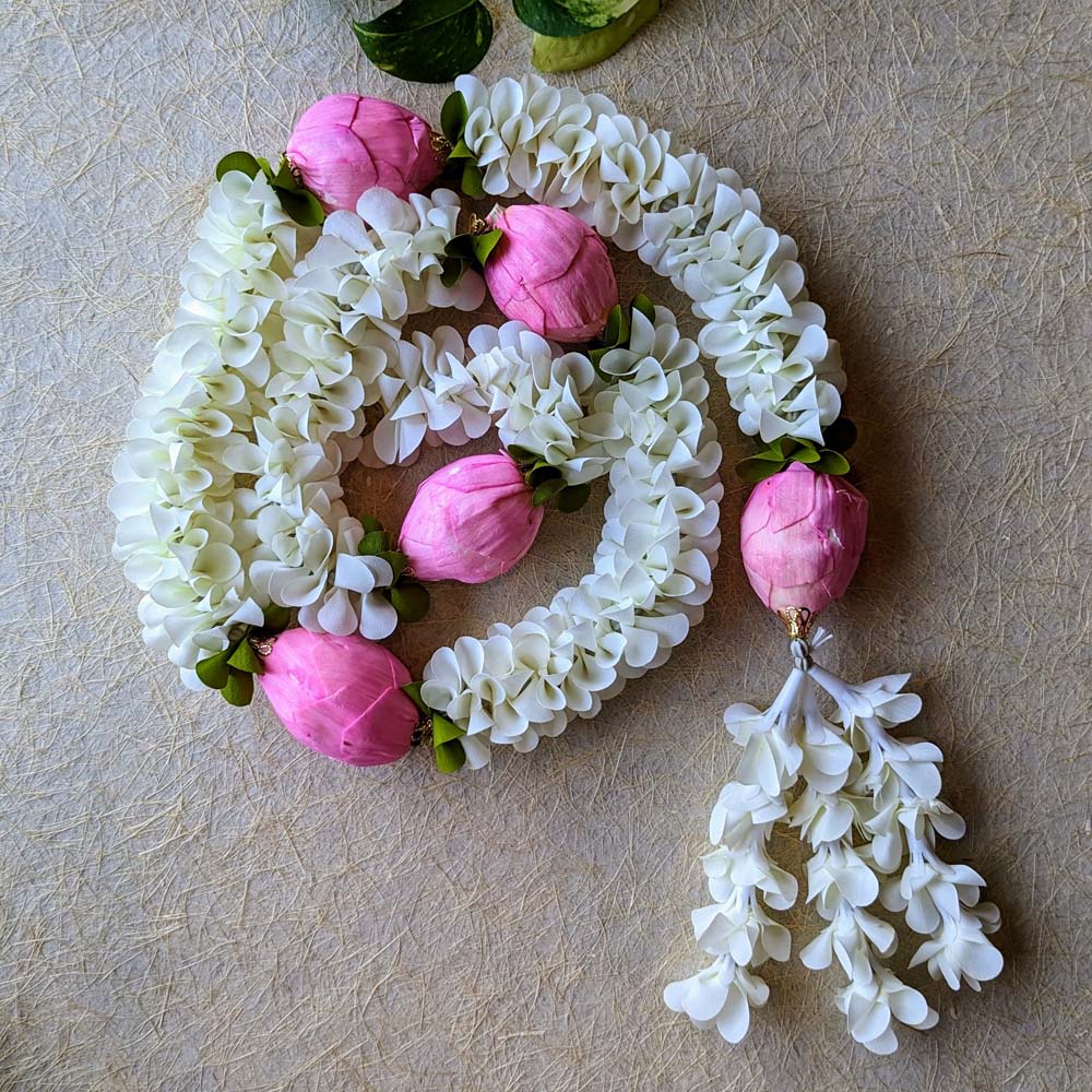 Handcrafted white flower garland with pink lotus accents, perfect for pooja and festive decor.