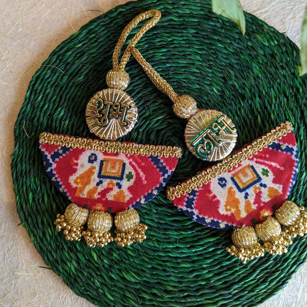 Handcrafted Subh Labh wall hanging set with Patola-inspired fabric, golden embellishments, and intricate detailing.