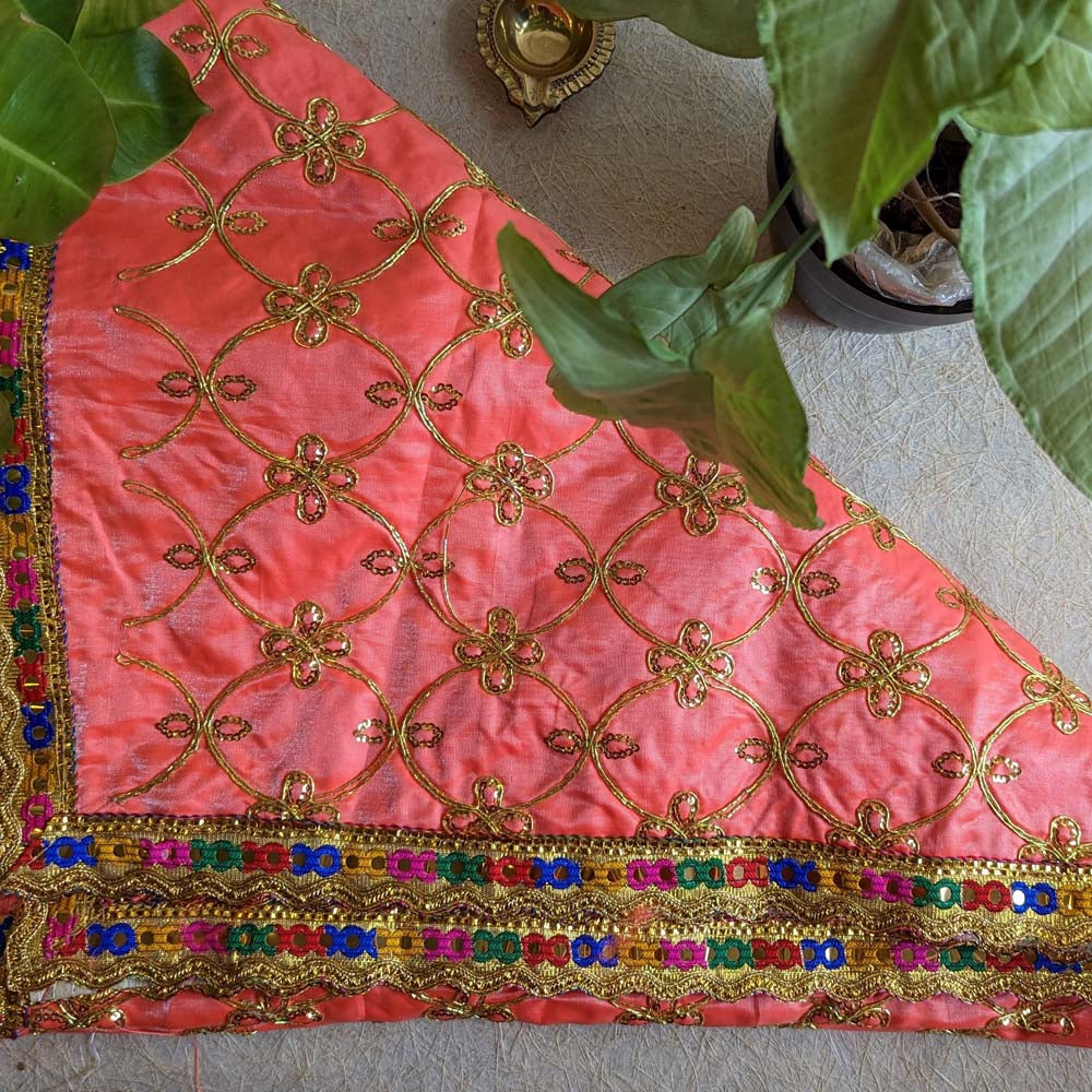 Peach Chunari with gold floral embroidery and colorful embellished border, ideal for religious and festive decor.